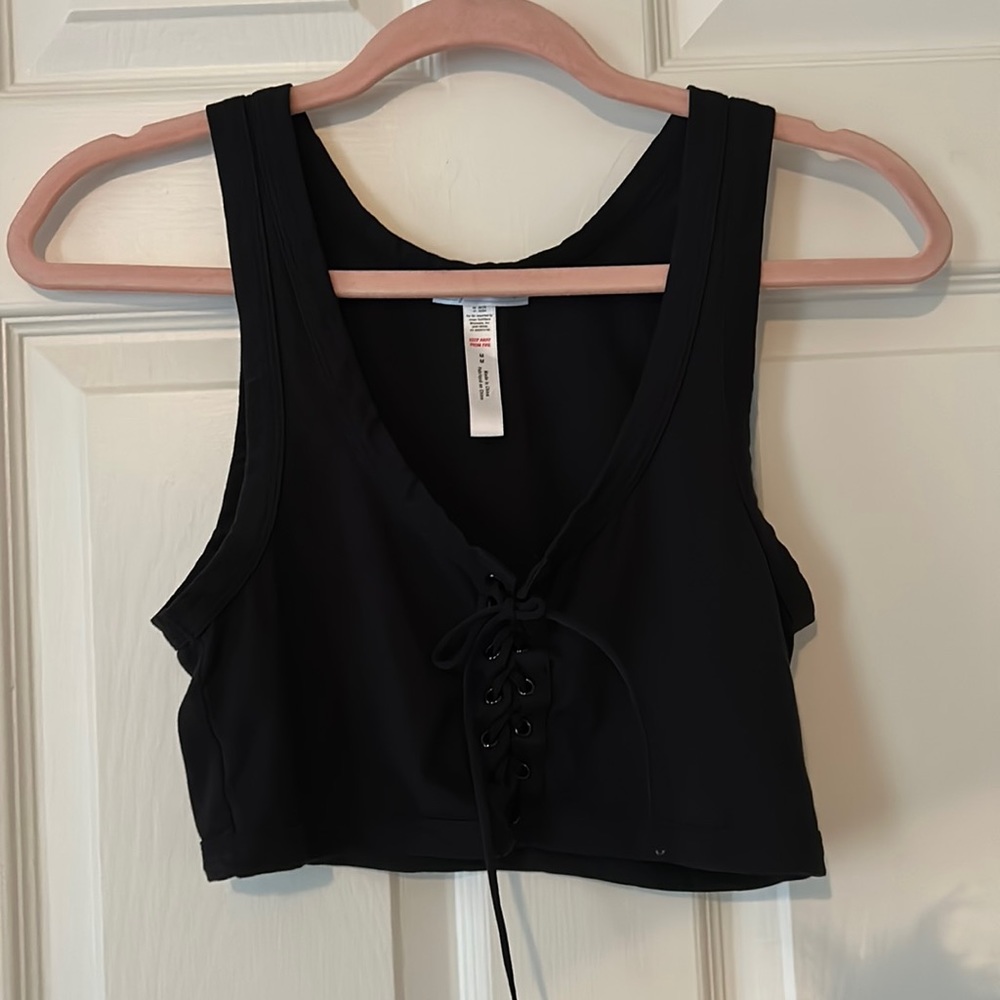 Cute black crop top with lace up front!